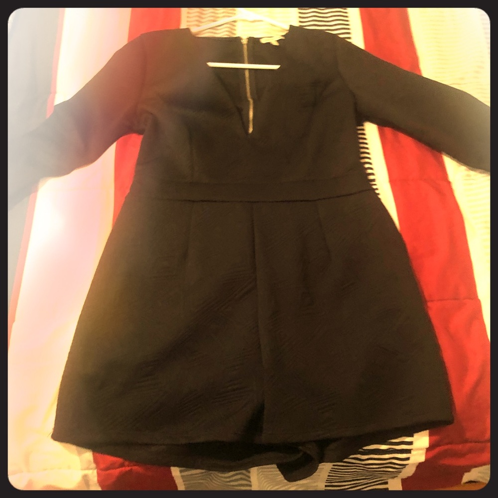 Black long sleeve romper.